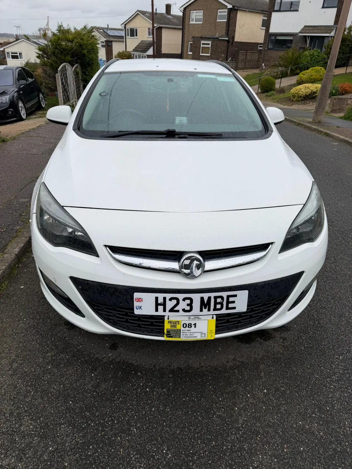 MBE Minicabs white Vauxhall Astra H23 MBE - reliable taxi service